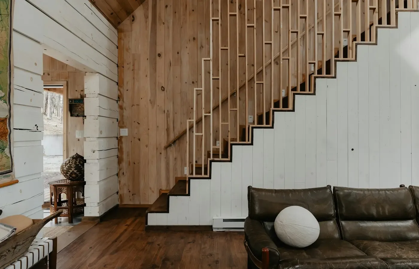 Sofa being moved up a stairwell